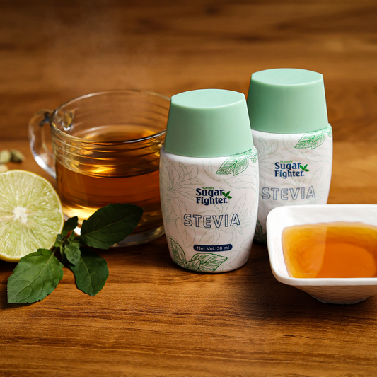 Two bottles of Sugar Fighter Stevia on a wooden surface with a cup of tea and honey.